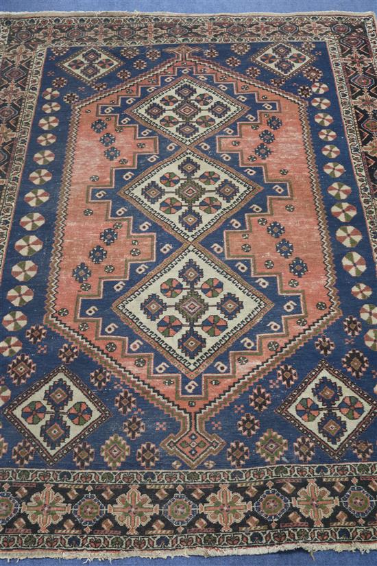 A Caucasian coral and blue ground rug, 180cm x 140cm